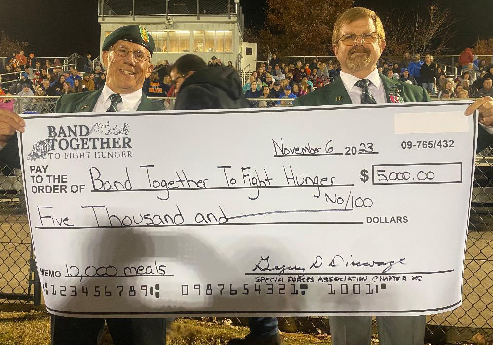 Chapter 90 members present big check to Band Together To Fight Hunger​​