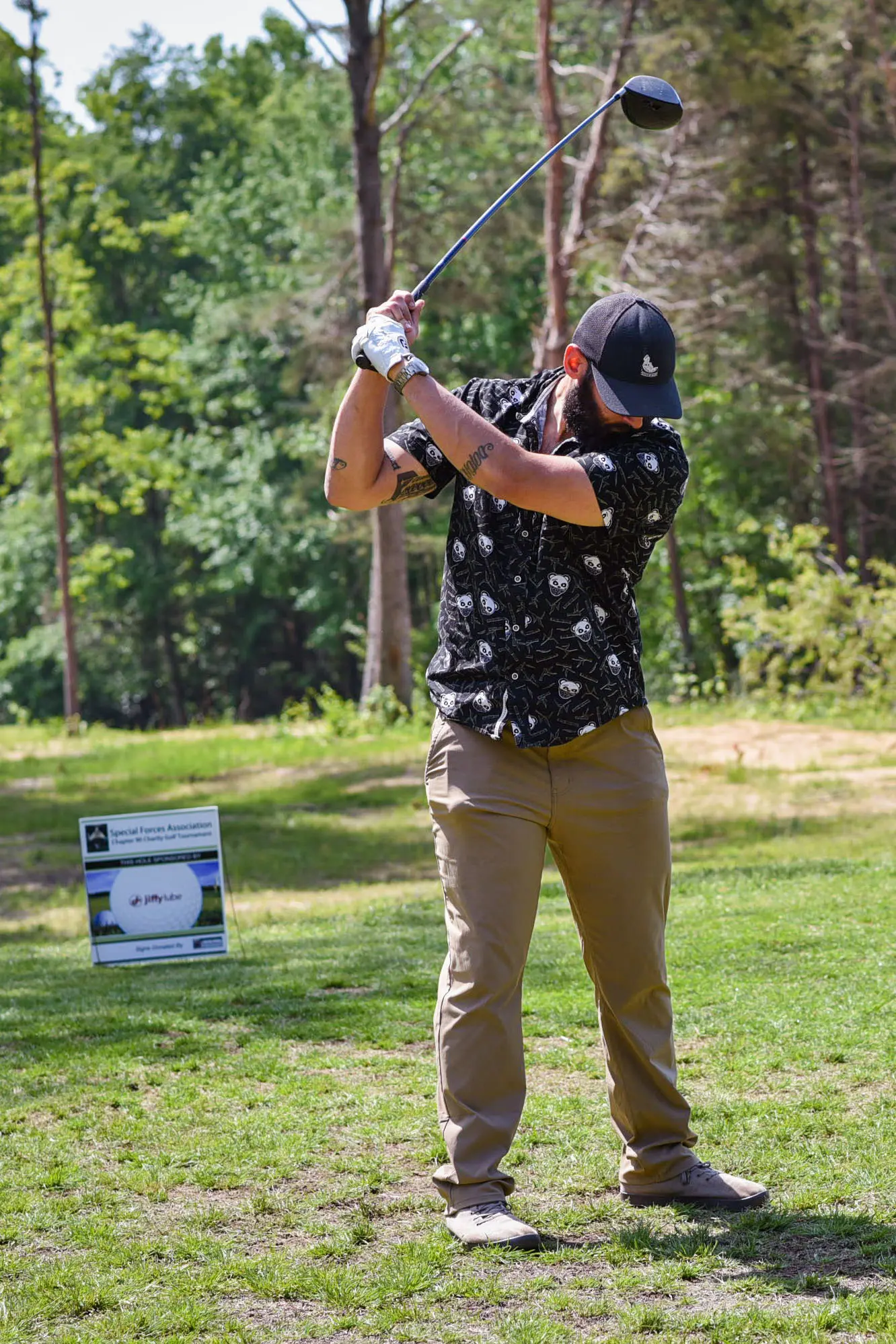 man about to swing a golf club