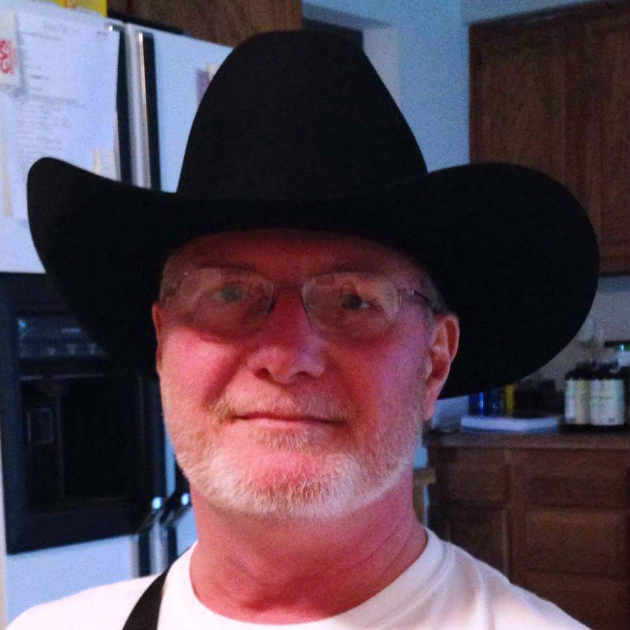 Bill Billingslea wearing a black cowboy hat