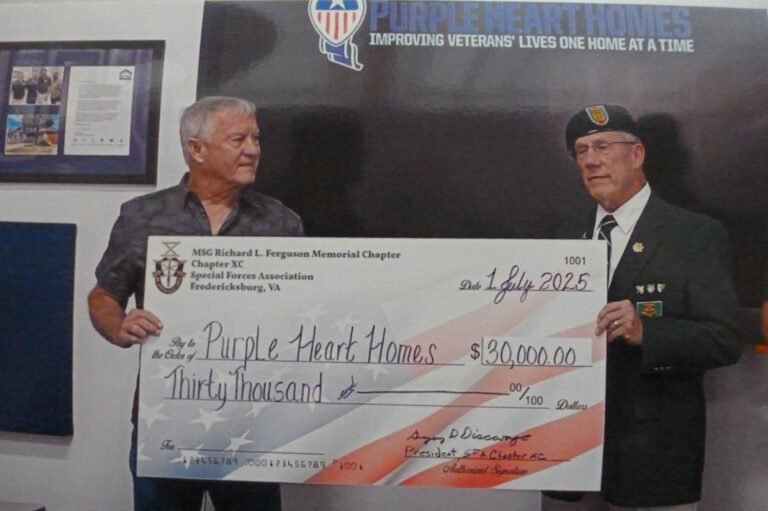 Chapter President Greg Discavage presents a $30,000 check to PHH Executive Director