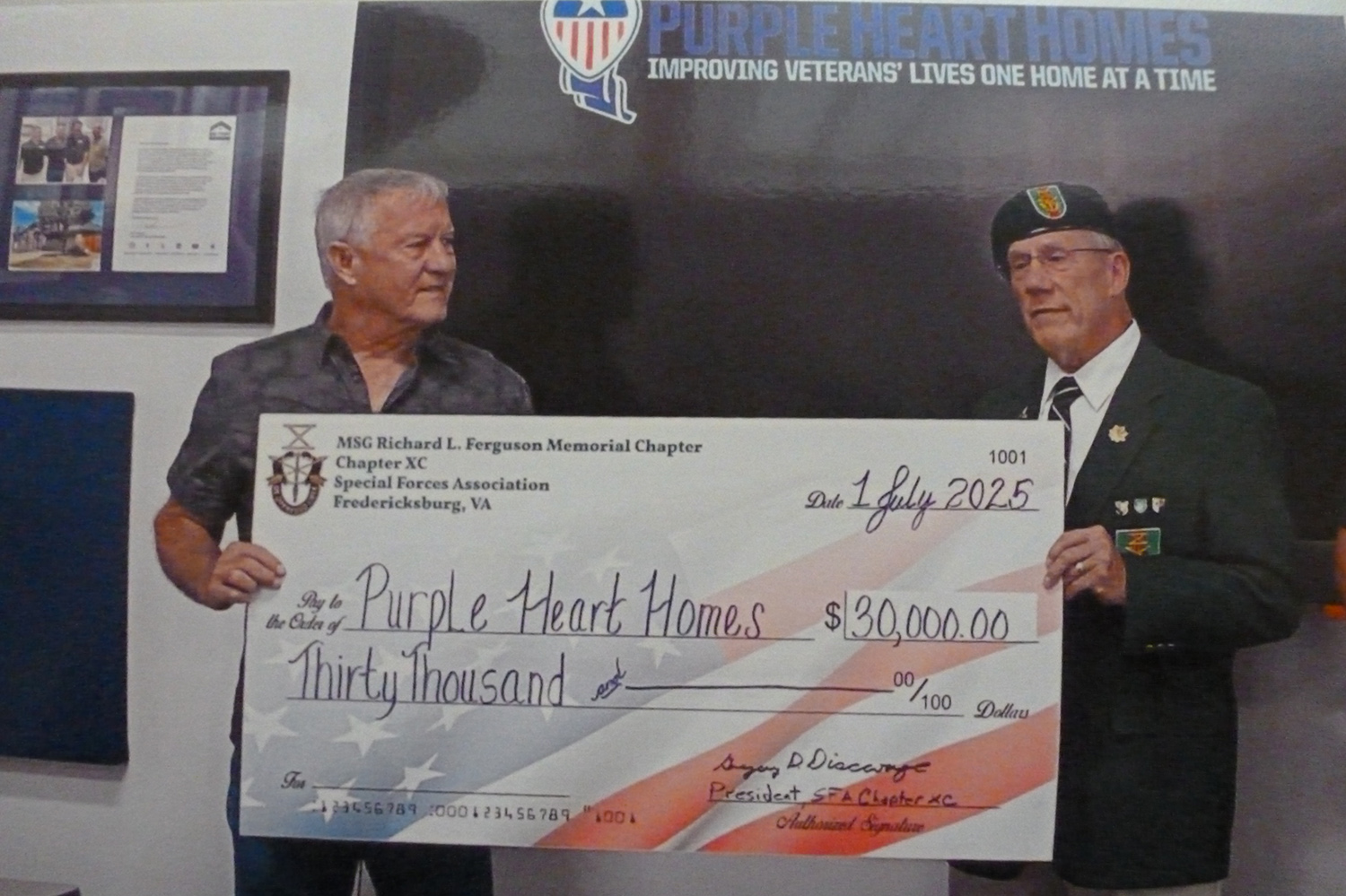 Chapter President Greg Discavage presents a $30,000 check to PHH Executive Director